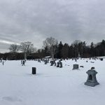 landscape photo of old graveyard in snow