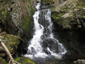 Waterfall over mossy rocks