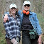 TerraCorps members Brigid and Susan in the woods during a trailwork day