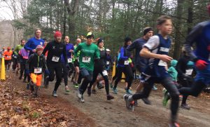 A large group of runners departs the starting line at the Gorge après Gorge.