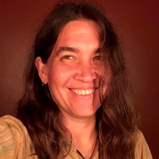 A close-up image of Gaby Immerman smiling into the camera.